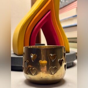 Brass Valentine’s Day candle holder with heart shaped cutouts
